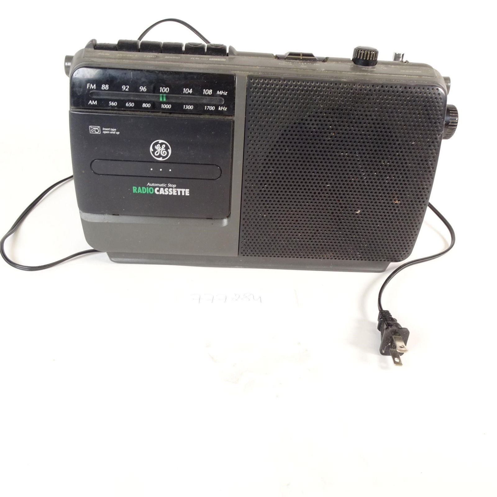 Vintage GE Portable AM/FM Radio Cassette Player: Vintage General Electric (GE) portable AM/FM radio cassette player with classic 1980s-1990s design. This unit features AM/FM radio, cassette tape player with automatic stop, built-in speaker, carry ha