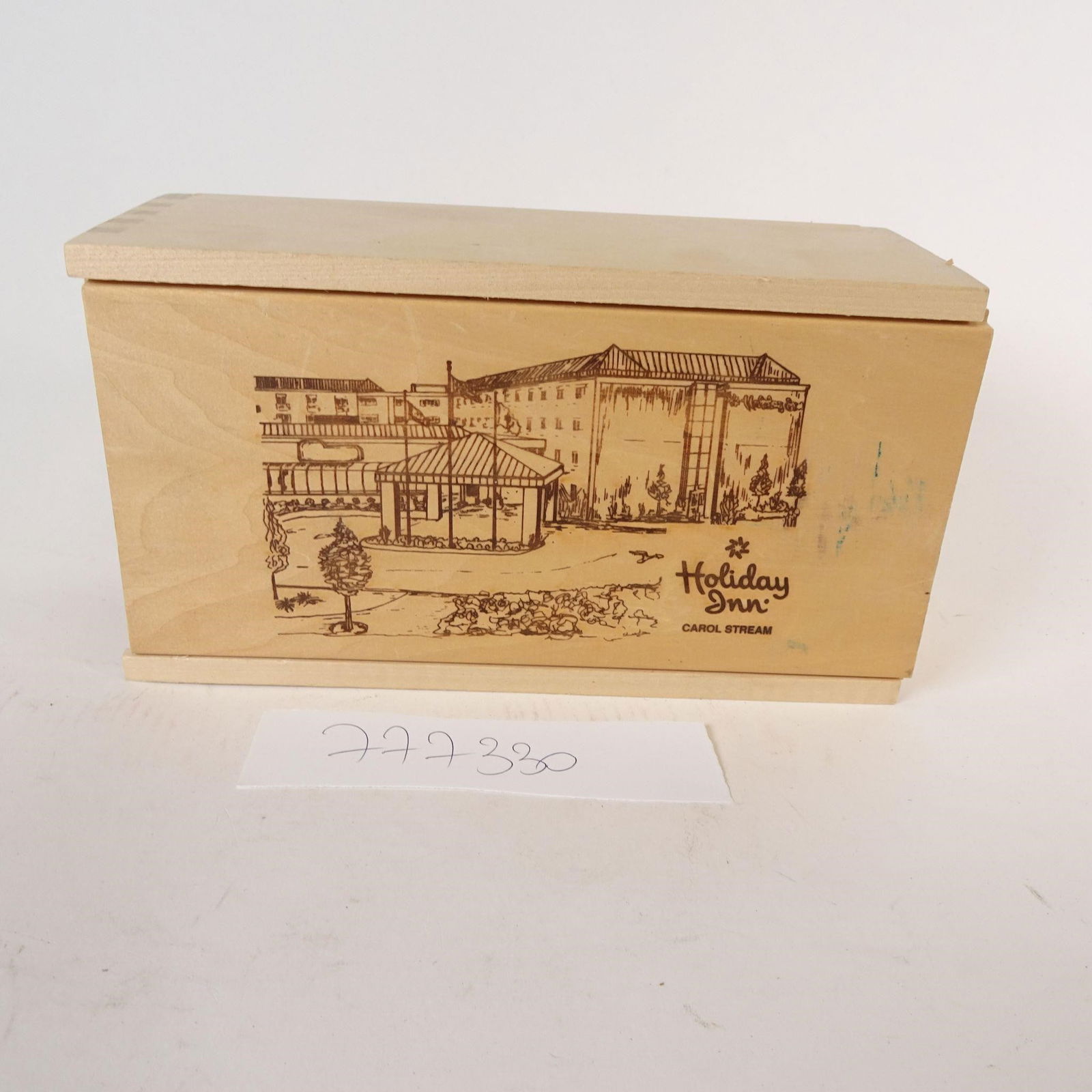 Vintage Holiday Inn Carol Stream Wooden Box: Vintage wooden keepsake box featuring an engraved illustration of Holiday Inn - Carol Stream. The box is made of light natural wood and includes a sliding lid with a detailed hotel illustration, makin