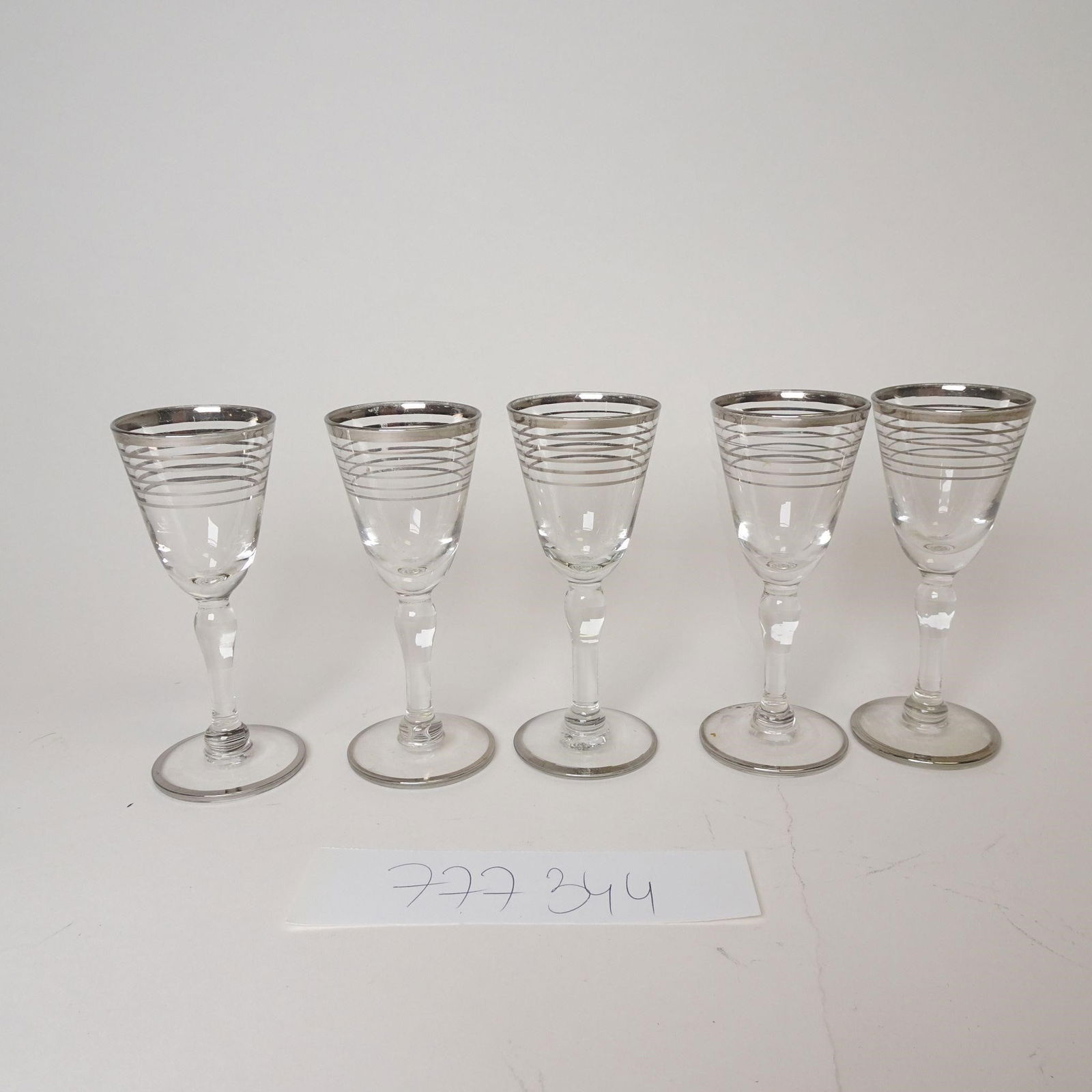 Vintage Stemmed Glasses with Silver Rim: Offered for sale is a set of 5 stemmed glasses, made of clear glass and decorated with a silvered rim and fine horizontal bands near the top of the bowl. Classic and elegant design, suitable for: - li