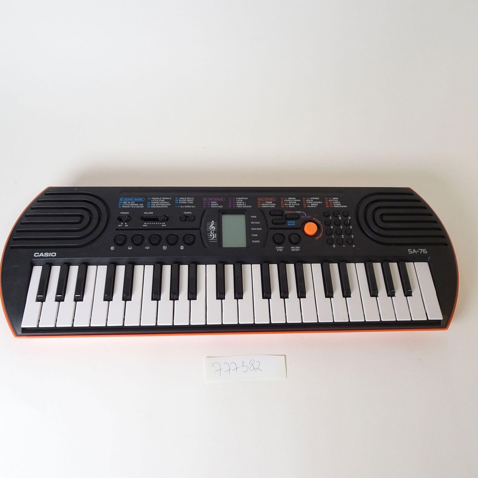 Casio SA-76 Electronic Keyboard: Compact Casio SA-76 electronic keyboard, designed for beginners and children. Features 44 mini keys, 100 built-in tones, 50 accompaniment rhythms, and 10 demo songs. Includes built-in speakers, LCD di