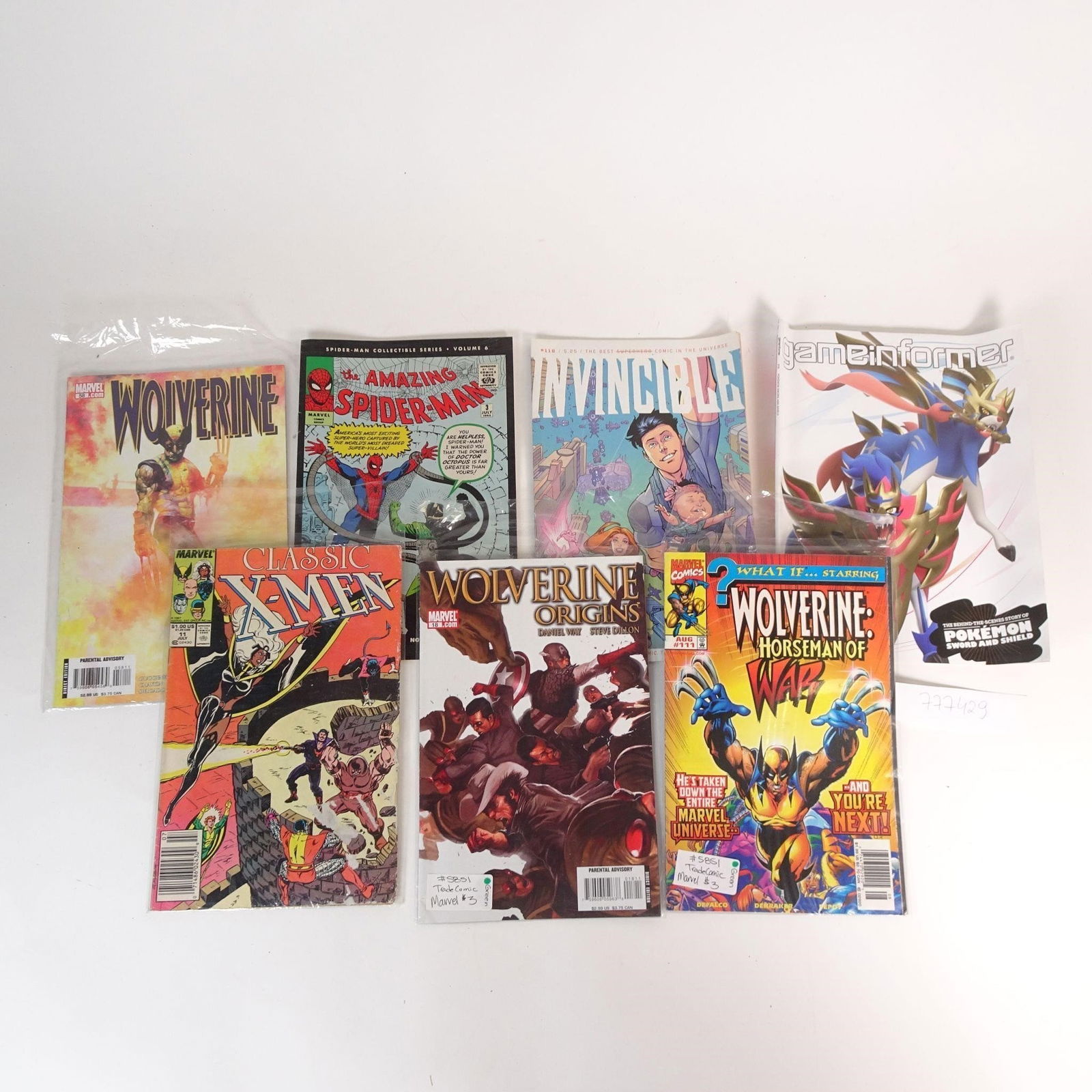 Comic Book Lot: A mixed comic book and magazine lot featuring titles from Marvel Comics and Image Comics. The set includes popular characters such as Wolverine, Spider-Man, and X-Men, plus an issue of Invincible. Als