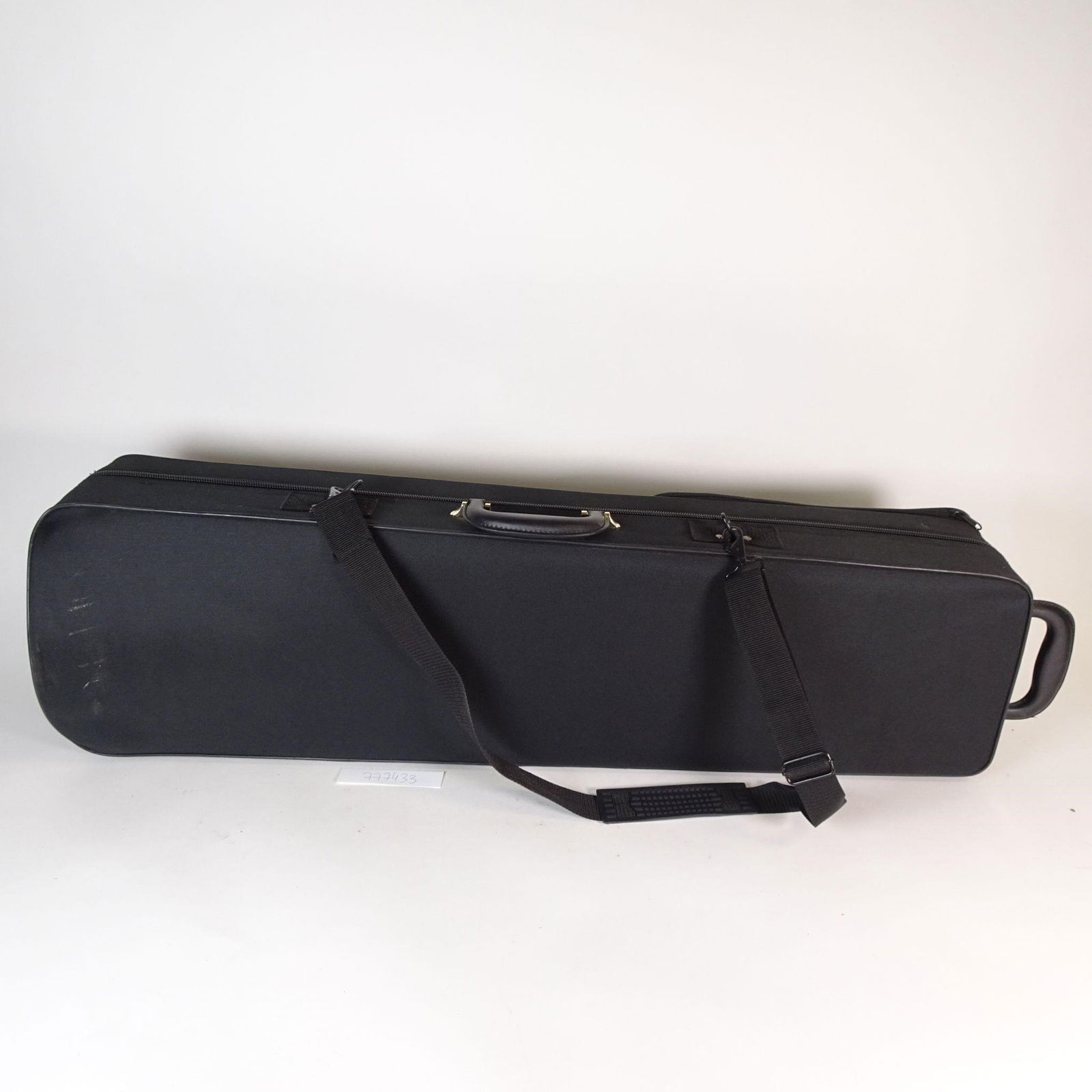 Tenor Trombone Brass Instrument with Hard Case: Tenor trombone in classic brass finish, offered with a hard protective case. The instrument appears to be in good used condition with light, normal signs of wear. The slide appears functional based on