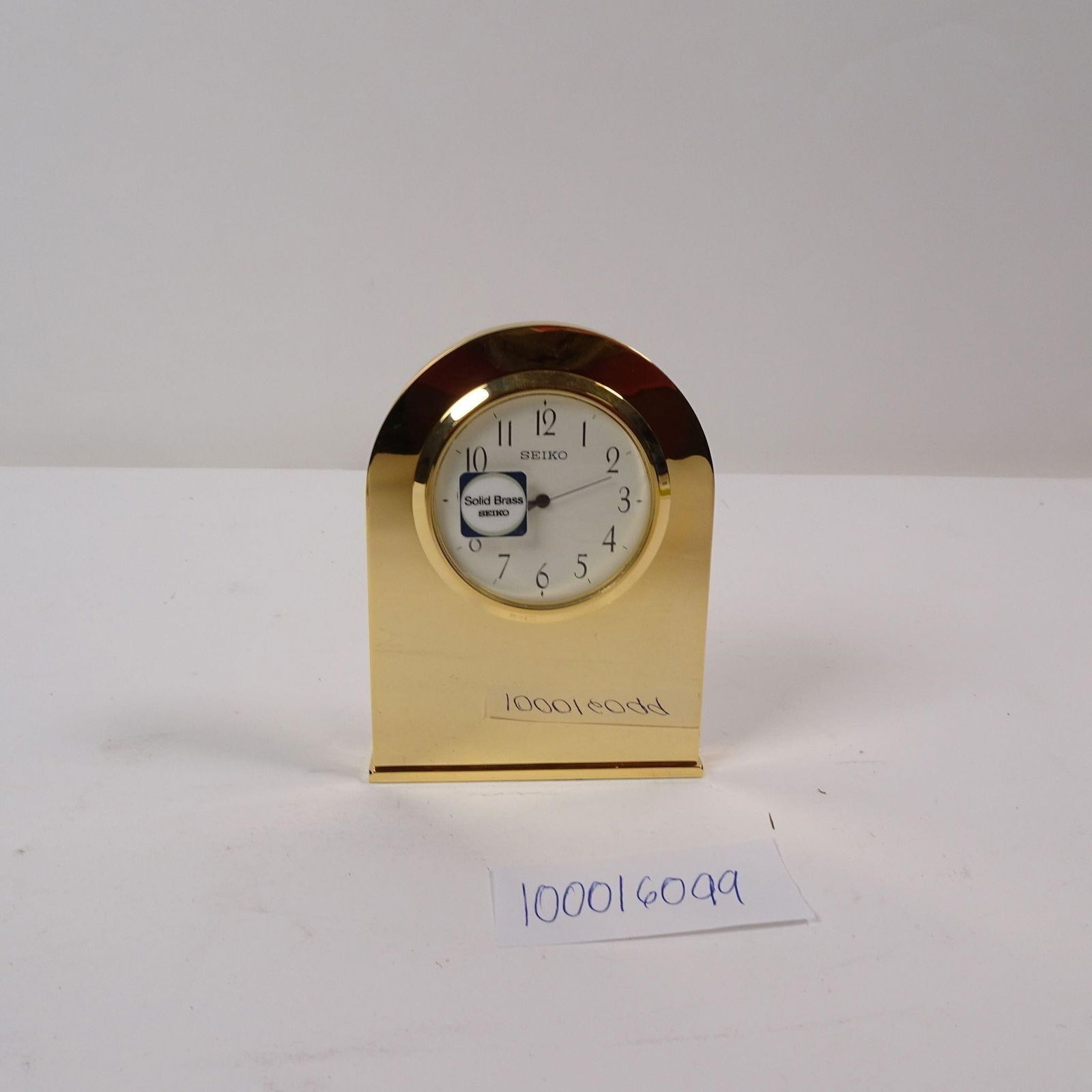 SEIKO Solid Brass Gold Tone Desk Clock: SEIKO solid brass gold-tone desk clock. Elegant design with timeless appeal, ideal for office, home dÃ©cor, or collection. Condition varies; please refer to photos for details.Sold as-is. No liabili