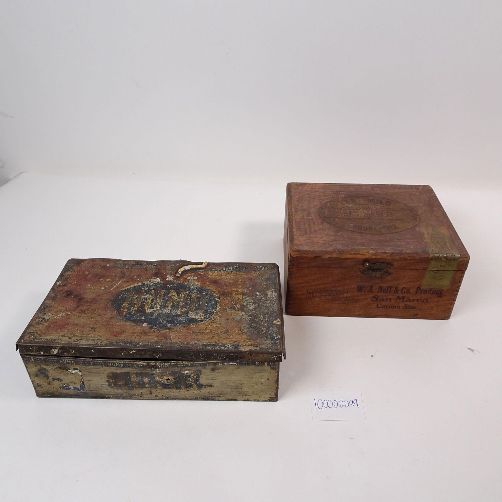 Vintage Cigar Boxes Set of 2: A set of two vintage cigar boxes, perfect for adding a touch of classic charm to any space. One is metal and one is wooden. These decorative pieces are ideal for unique storage, crafting, or as stylis
