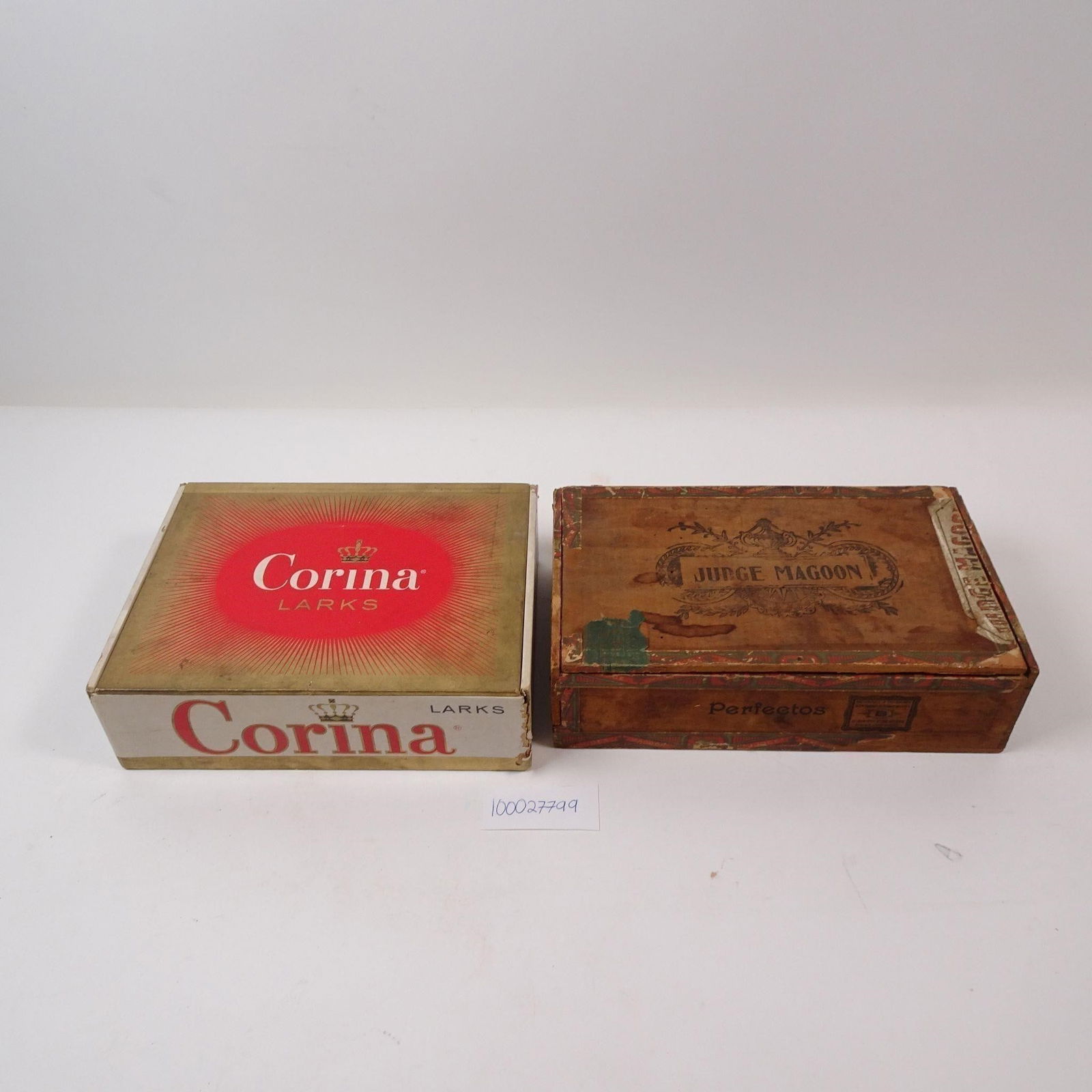 Vintage Wooden Cigar Boxes Set of 2: A set of two vintage wooden cigar boxes, perfect for adding a touch of classic charm to any space. These decorative pieces are ideal for unique storage, crafting, or as stylish accents on a bookshelf