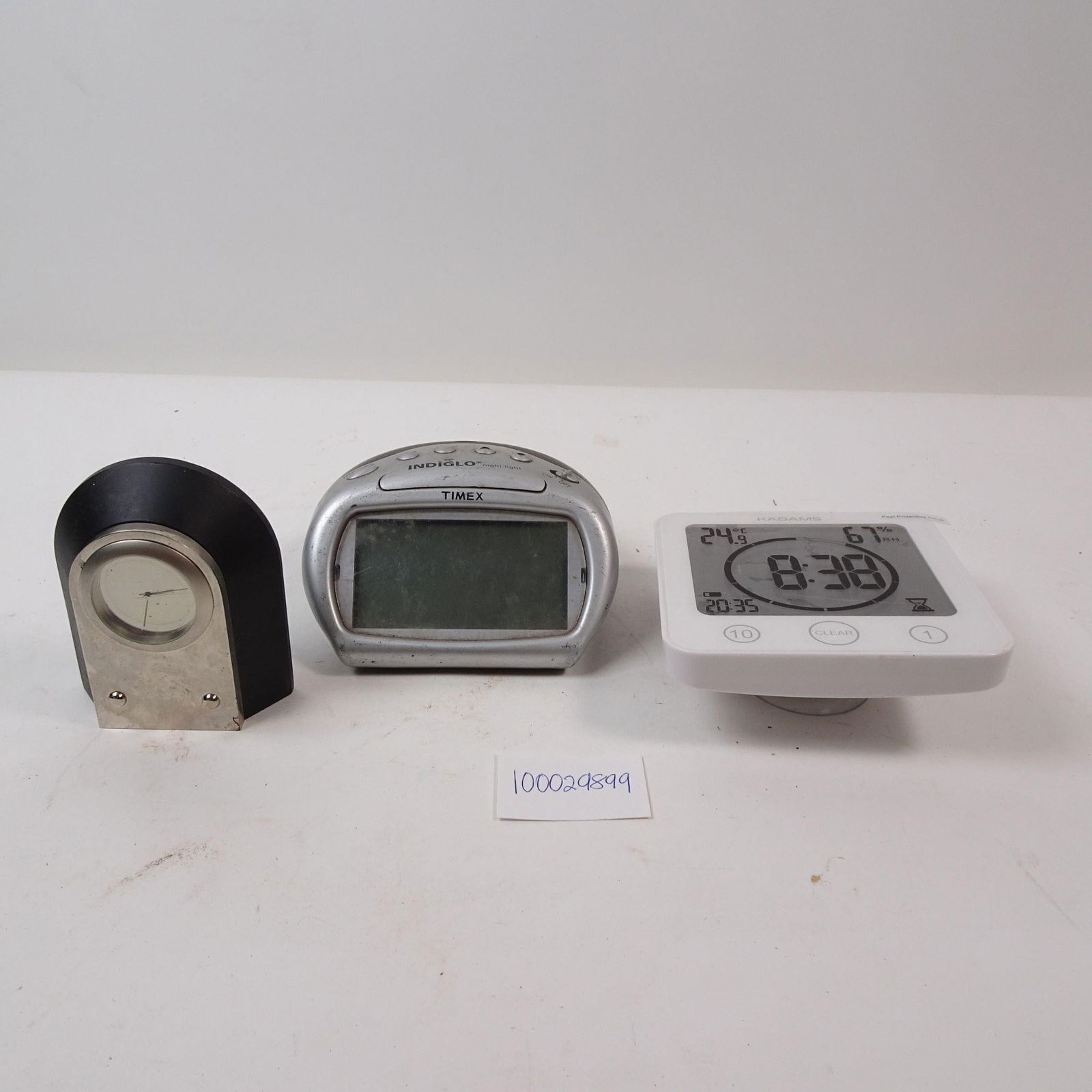 Set of 3 Digital and Analog Clocks: A functional set of three clocks, featuring both digital and analog displays. This collection is perfect for tracking different time zones or adding a practical and varied touch to your office or home