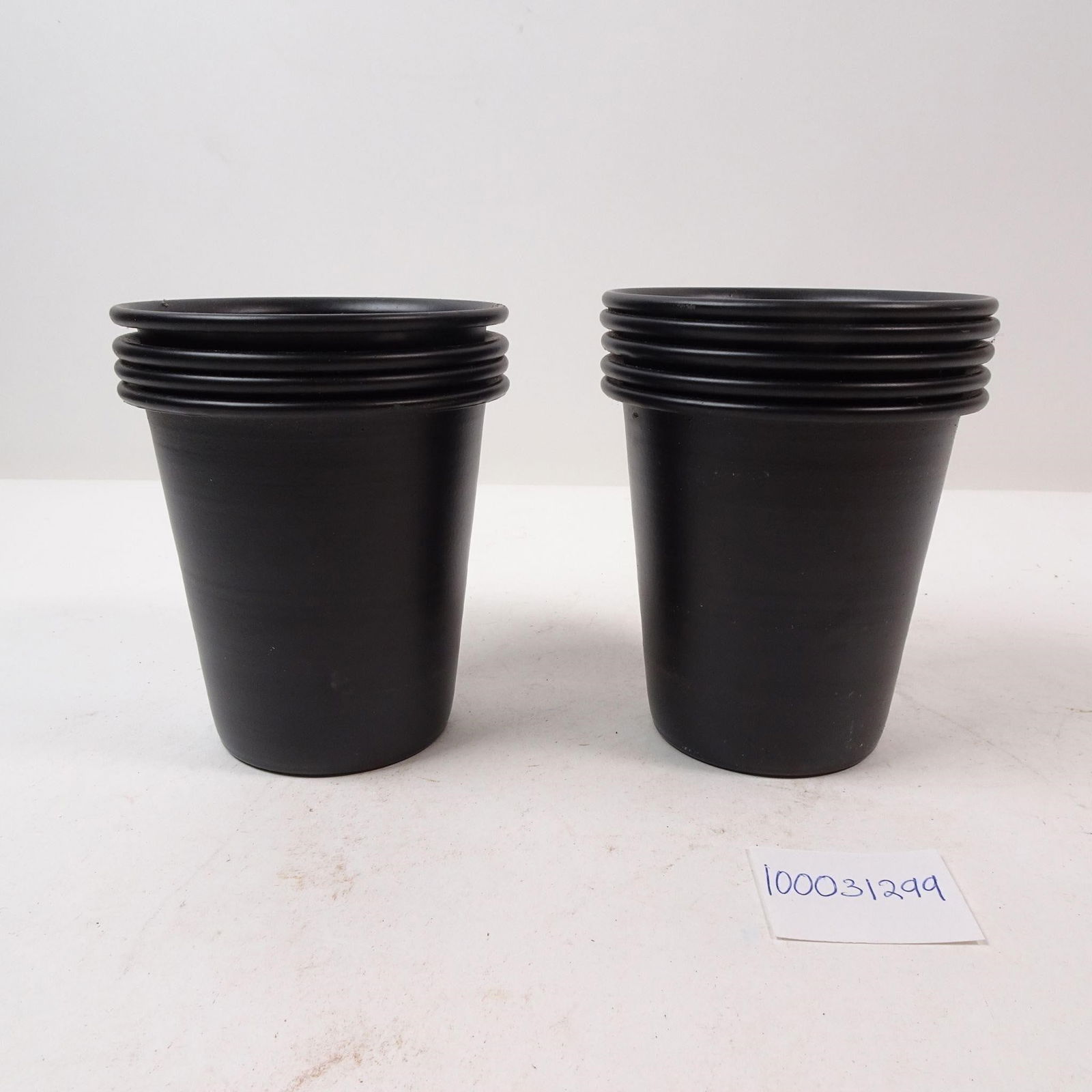 Set of 9 Metal Black Cups: A set of nine functional metal black cups, perfect for everyday use, camping, or adding a sleek, modern touch to your kitchen. This durable and versatile collection is ideal for serving beverages or a