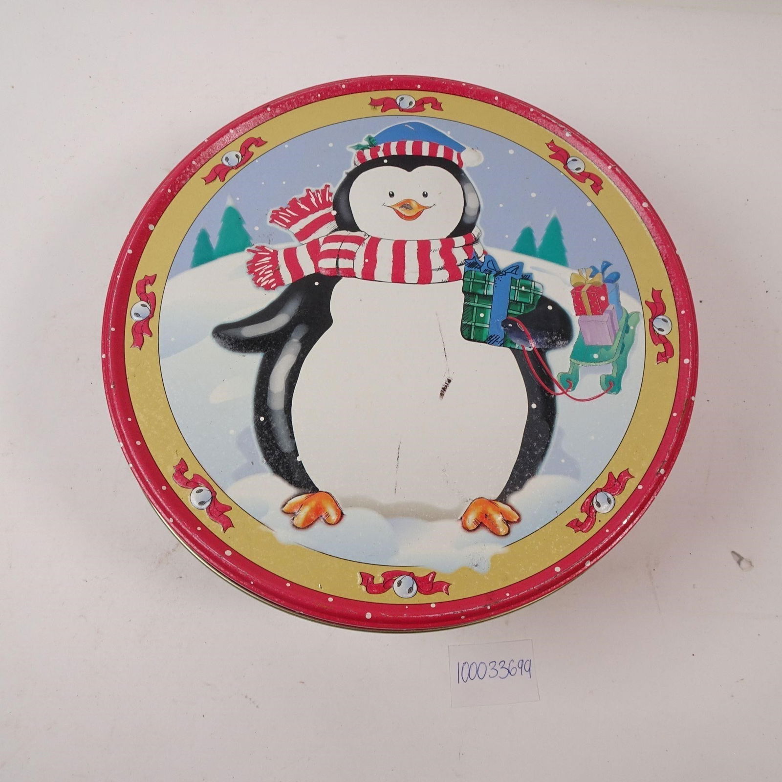 Vintage Round Christmas Tin: A festive vintage round Christmas tin, perfect for storing holiday cookies, candy, or small gifts. This charming piece adds a touch of nostalgic festive spirit and classic holiday dÃ©cor to any kitc