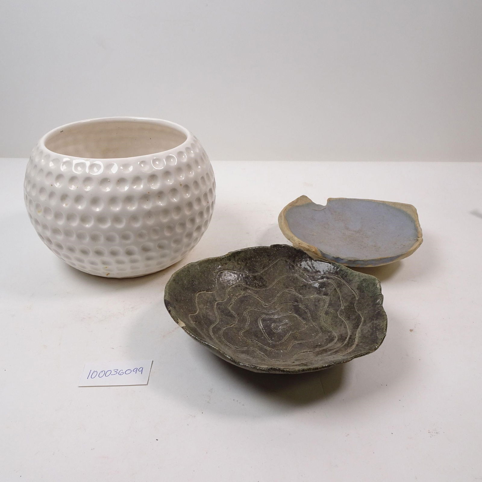 Ceramic Dishes, Vase and Ashtray: An eclectic assortment of ceramic pieces, including decorative dishes, a vase, and an ashtray. This collection is perfect for adding character to any table setting or display, offering a mix of functi