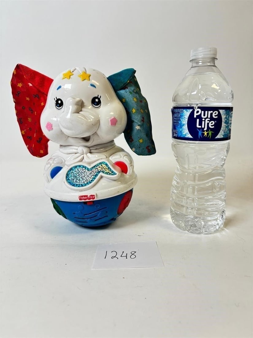 Fisher Price Sparkaling Symphony Twinkle Dancer Elephant: Fisher-Price Sparkling Symphony Twinkle Dancer Elephant â?? Interactive musical toy with lights and movement. Condition varies; please refer to photos for details.