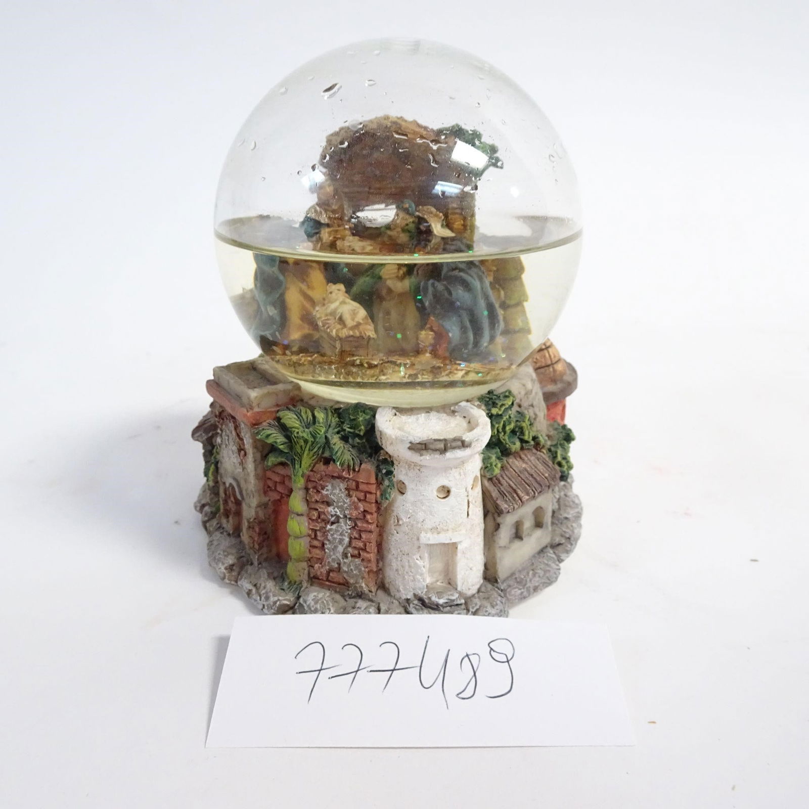 Nativity Snow Globe Music Box: Decorative snow globe music box featuring a detailed Nativity scene. Produced by the well-known San Francisco Music Box Company. Inside the glass globe is a beautifully crafted scene with Mary, Joseph