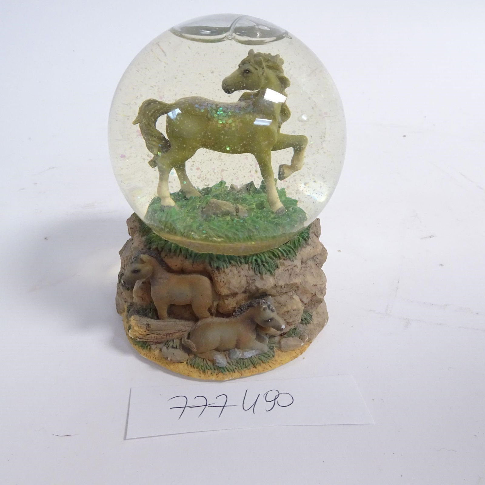 Horse Snow Globe Music Box: Decorative horse-themed snow globe music box featuring a standing horse inside the glass globe and a detailed base with two foals set in a rocky landscape. Produced by San Francisco Music Box Company.