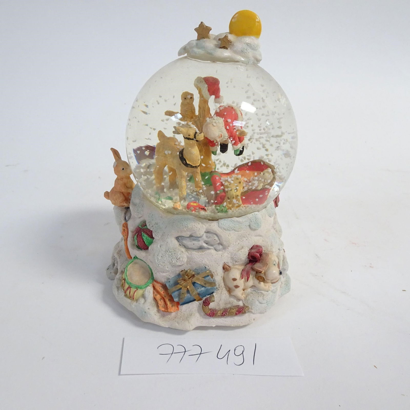 Santa Claus Snow Globe: Classic Christmas snow globe featuring Santa Claus with animals and gifts. Highly detailed festive base. Snow effect when shaken. Very good condition - no cracks, light signs of age consistent with us
