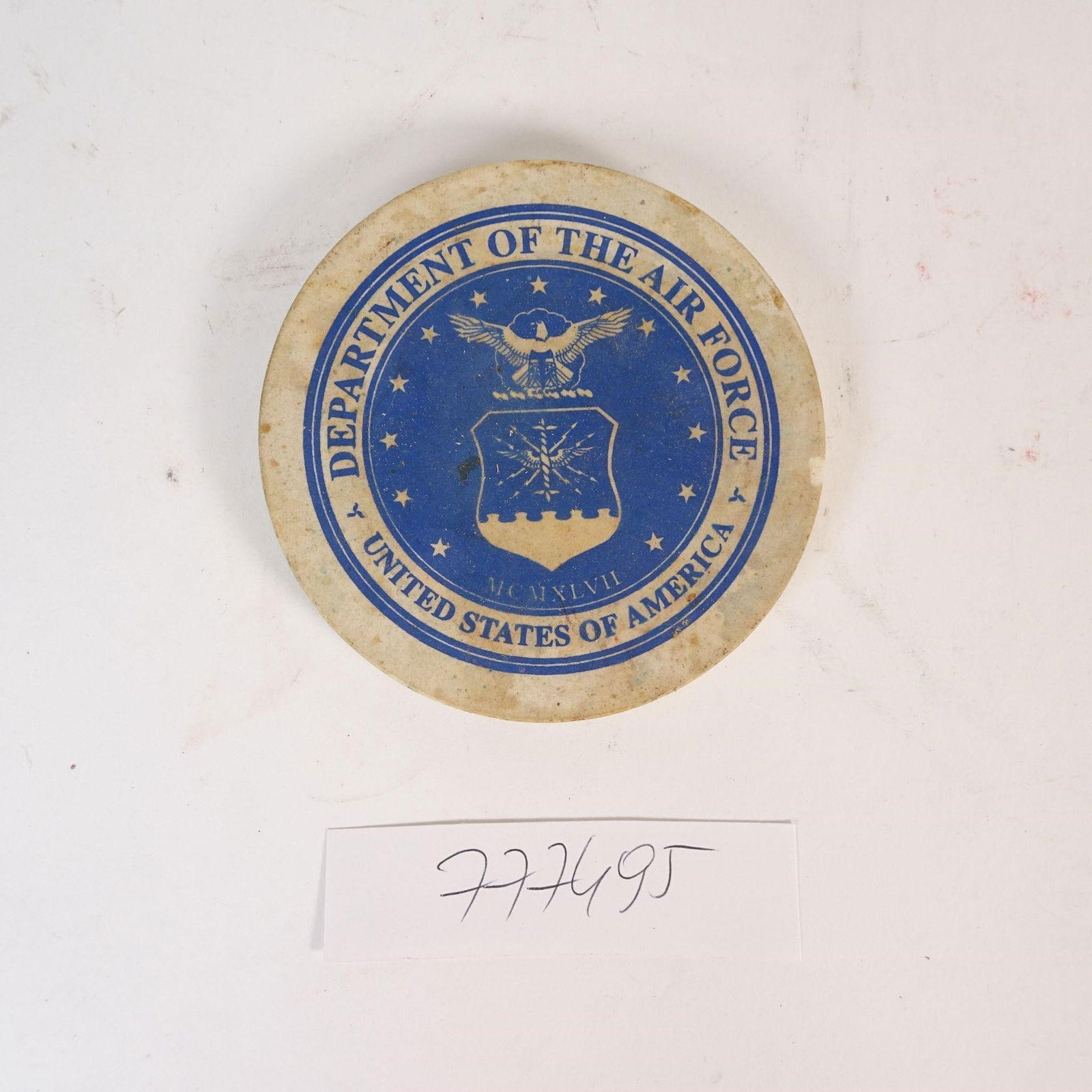 Vintage U.S. Air Force Stone Coaster: Original vintage round coaster featuring the Department of the Air Force - United States of America emblem. Made of stone or stone composite with a felt backing to protect surfaces. Displays the offic