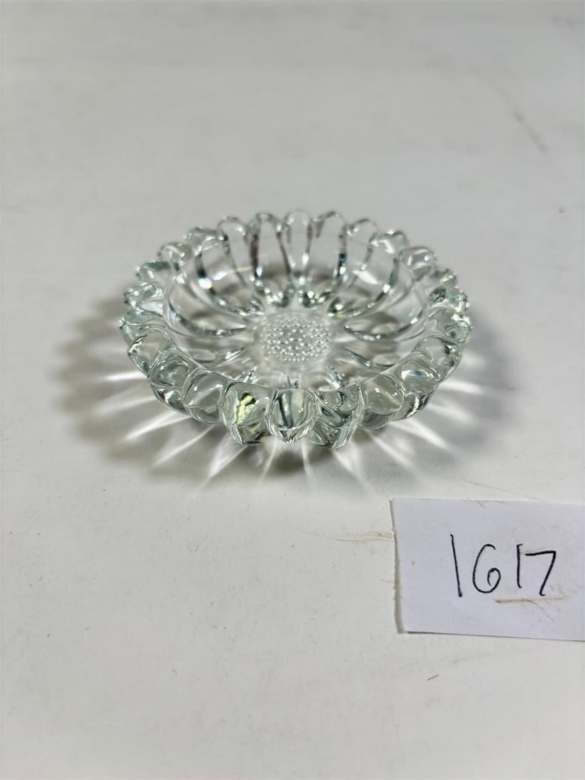 Vintage Mementos Glass Daisy Ashtray: Vintage Mementos Glass Daisy AshtrayCharming vintage glass ashtray featuring a delicate daisy design. A unique collectible piece with timeless appeal. Please review photos for condition details.