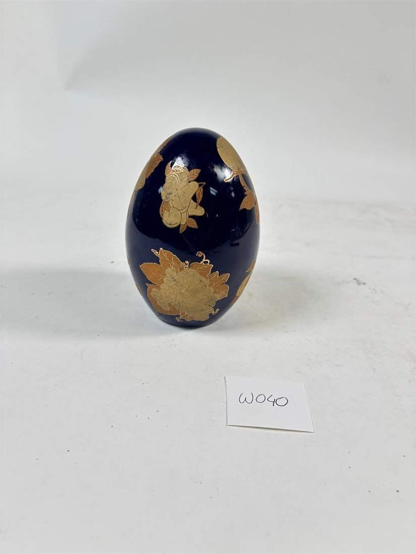 Vintage Blue Ceramic Egg with Floral Design: A charming vintage blue ceramic egg featuring a delicate floral design. Refer to attached photos for details.