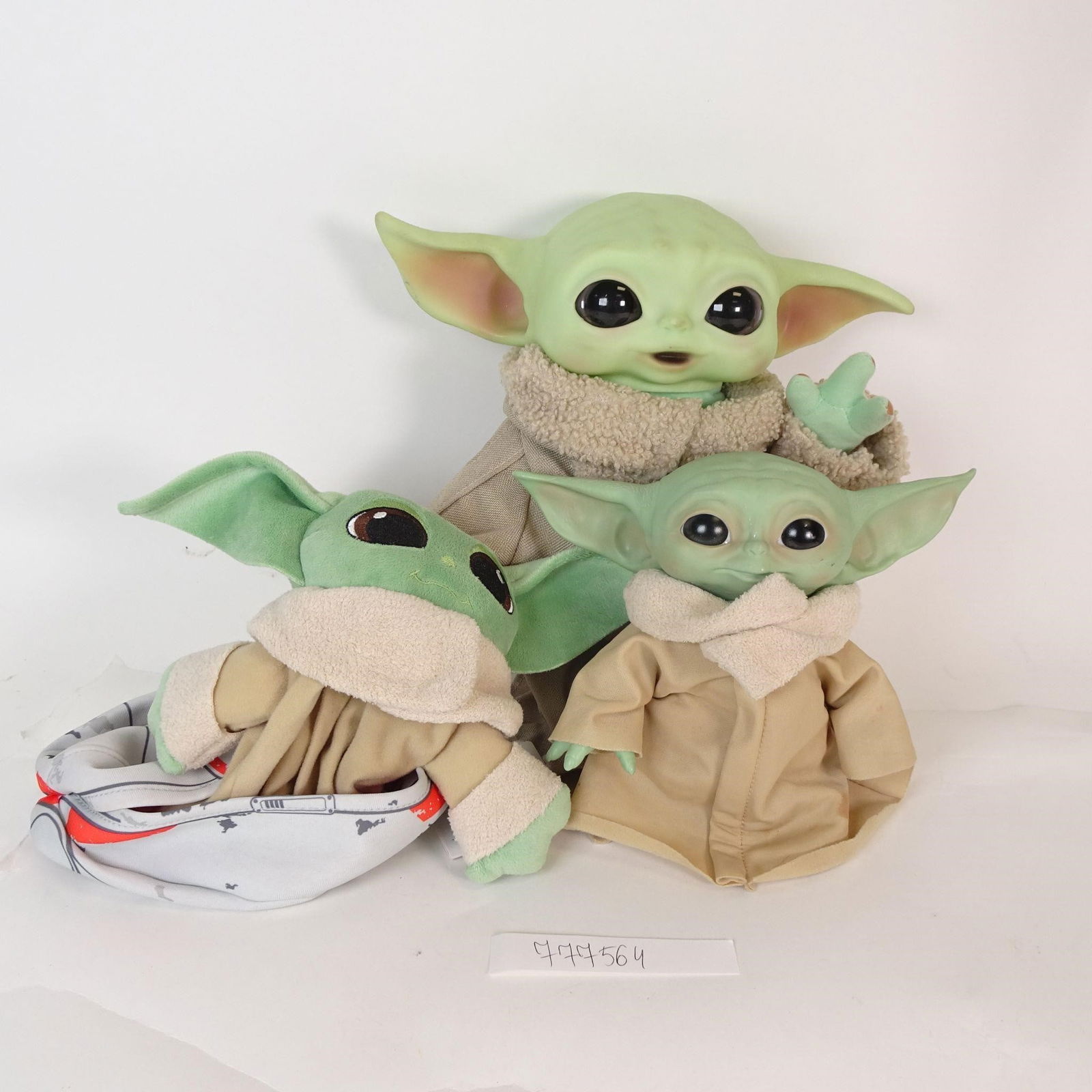 Lot of 3 Grogu (Baby Yoda) Figures: This listing is for one lot containing 3 Grogu (Baby Yoda) figures from the Star Wars universe. Perfect for Star Wars fans, collectors, or as a gift. Condition: - Good to very good pre-owned condition