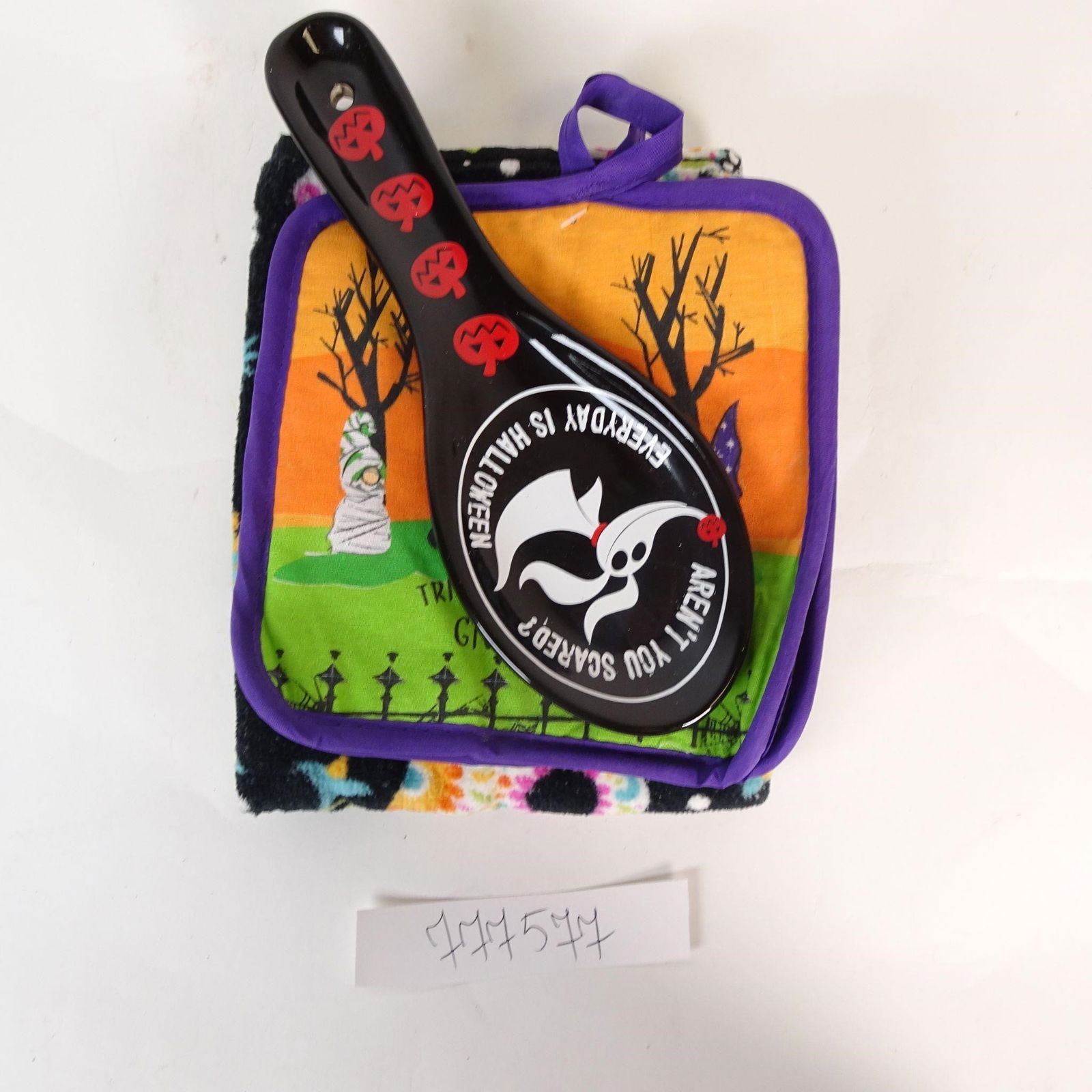 Disney The Nightmare Before Christmas Kitchen Set: Original kitchen set inspired by The Nightmare Before Christmas. This lot includes a ceramic spoon rest with Zero design, two matching pot holders, and a 100% cotton kitchen towel with colorful skull