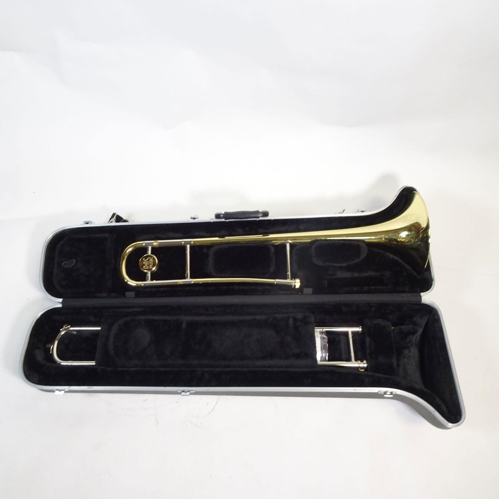 B.A.C. Apprentice Trombone: B.A.C Apprentice student trombone with smooth slide action and brass finish, complete with hard case. Ideal school band instrument for beginners and advancing students. Slide moves freely; instrument