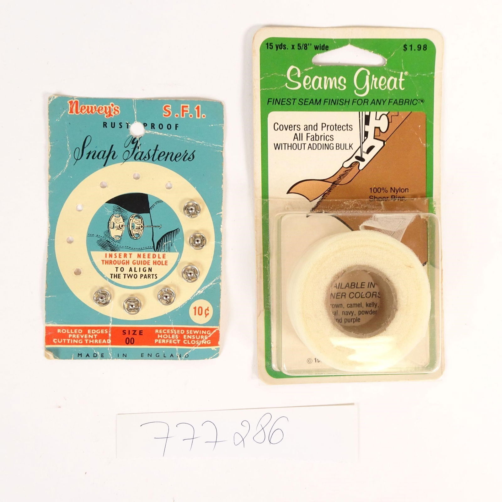 Vintage Sewing Notions Lot: Offered here is a vintage sewing notions lot featuring classic haberdashery items, ideal for collectors, sewing enthusiasts, or retro craft displays. Both items show authentic age-related wear to the