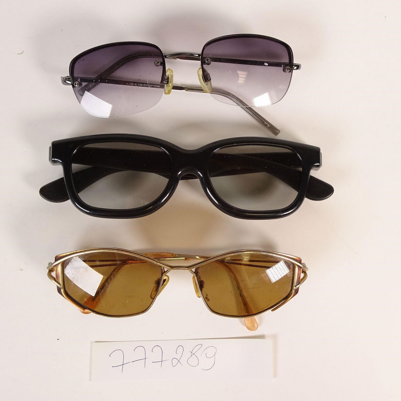 Vintage Eyewear Lot: Vintage eyewear lot featuring tree pairs of glasses. Mixed styles and eras. Ideal for collectors, prop use, or retro fashion display. Condition: Vintage/used; scratches, wear, and discoloration visibl