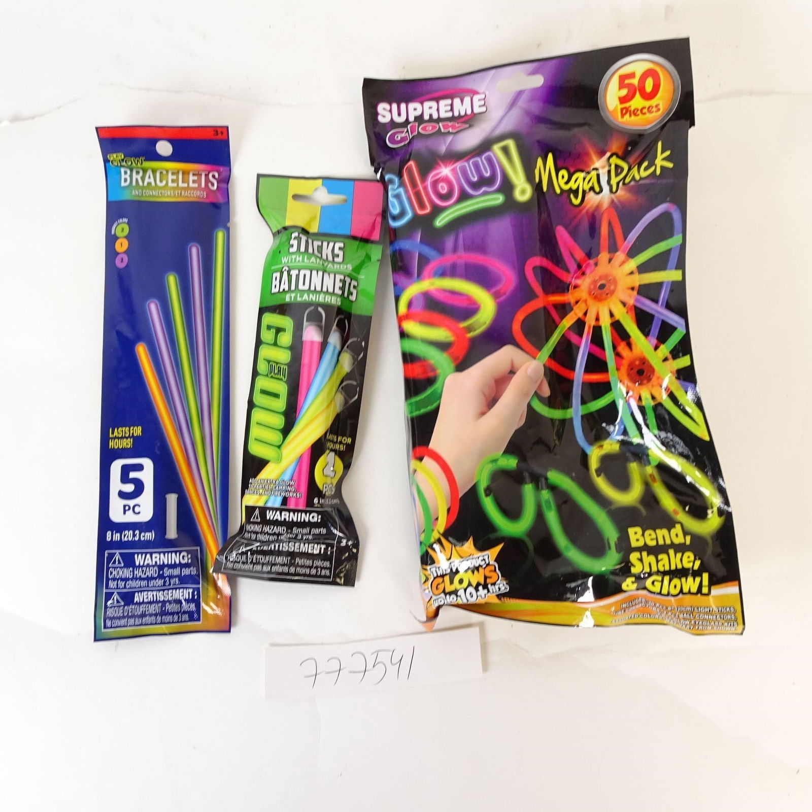 Glow Stick Party Pack - Bracelets & Sticks: Assorted glow stick party pack including bracelets, sticks, and a large glow set. Bright colors, sealed packages. Perfect for parties, events, and kids' fun.