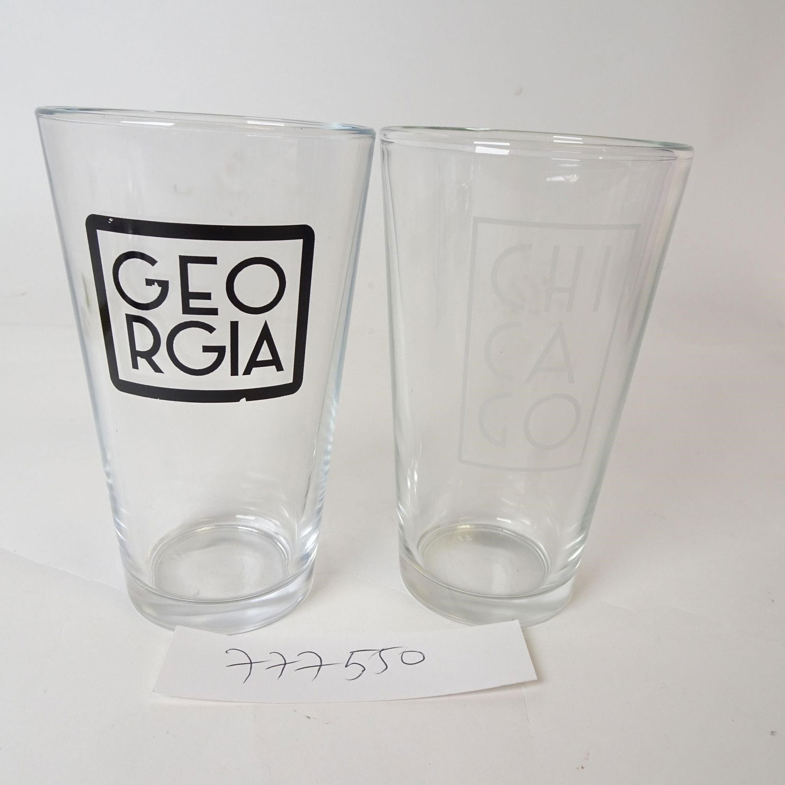 Logo Pint Glasses - Set of 2: Set of two clear pint glasses featuring a bold Georgia and Chicago logo design. Approx. 7 inches tall. Clean, modern look-great for everyday use, home bars, or souvenir collectors.