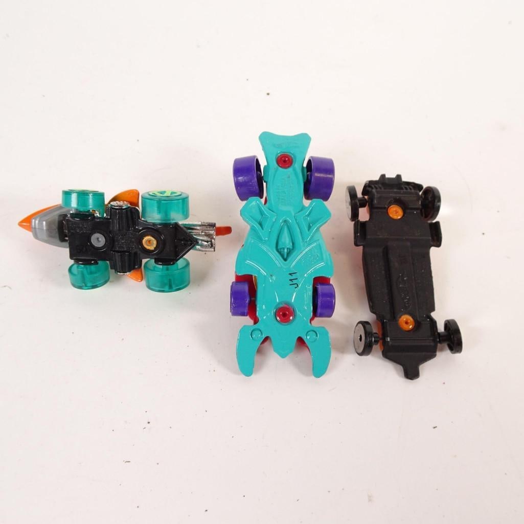 Hot Wheels & Mario Kart Toy Cars Lot: Lot of 11 toy cars including racing, fantasy models and a Mario Kart (Mario) vehicle. Includes: -Mario Kart character vehicle (Mario) -racing and sports cars -fantasy / futuristic vehicles -hot rod an