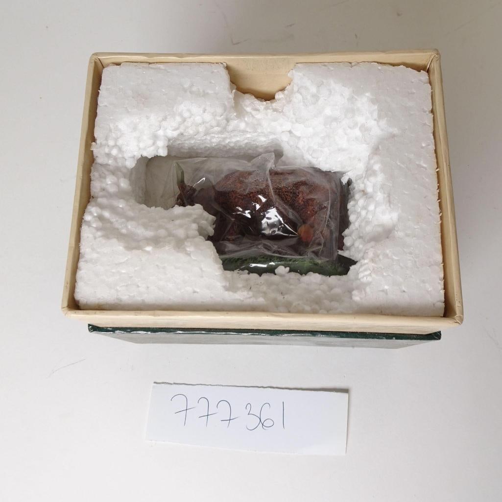 Colonial Williamsburg Figurine w/ Original Box: This auction features an authentic Colonial Williamsburg collectible figurine titled "Dairymaid Milking," produced by Lang & Wise Collectibles in 1997. Condition: - Figurine is in good vintage conditi