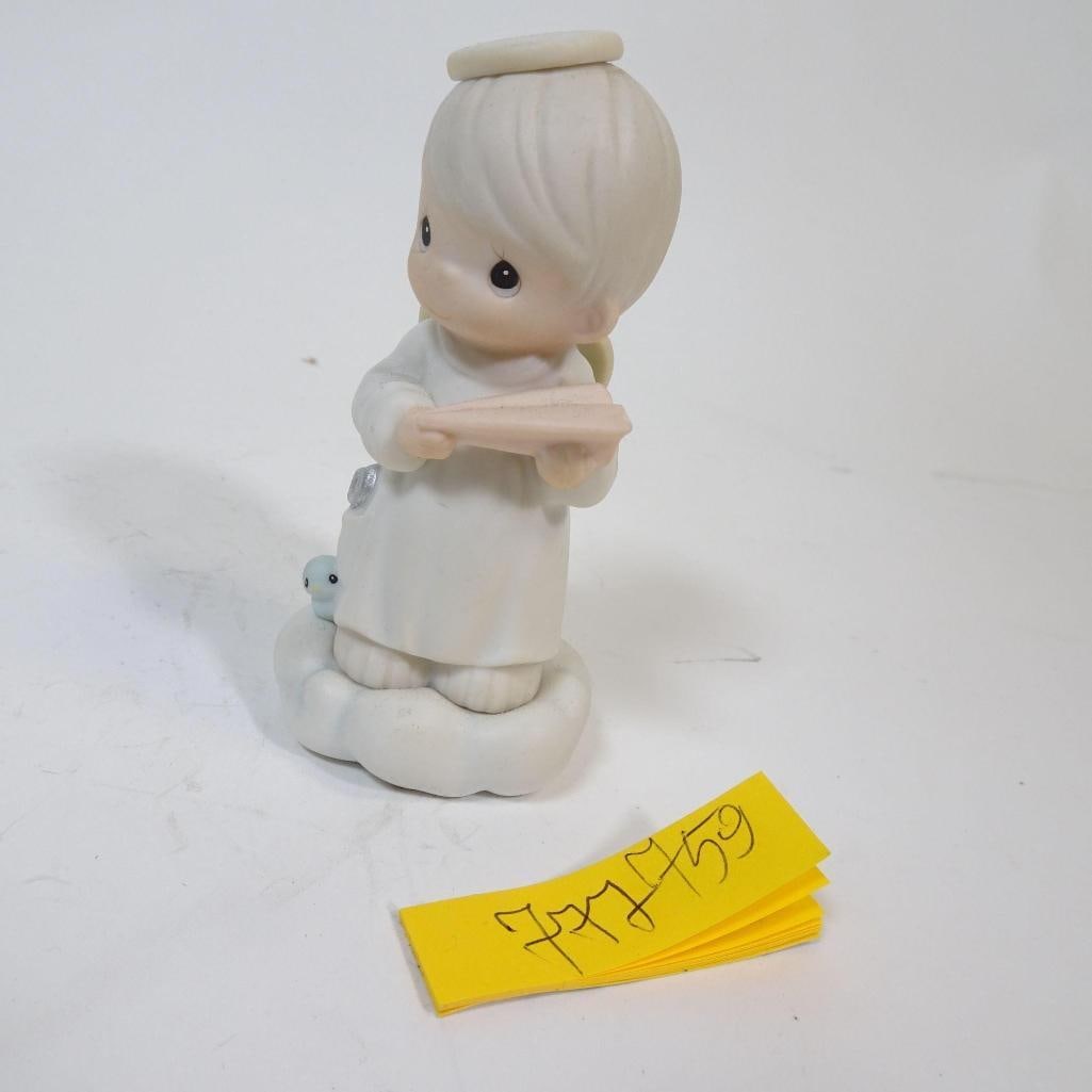 Angel Figurine Reading a Book: This sweet angel figurine features a gentle childlike angel with wings and a halo, standing on a cloud and holding a book. Finished in soft white and pastel tones, it has a calm, peaceful appearance t