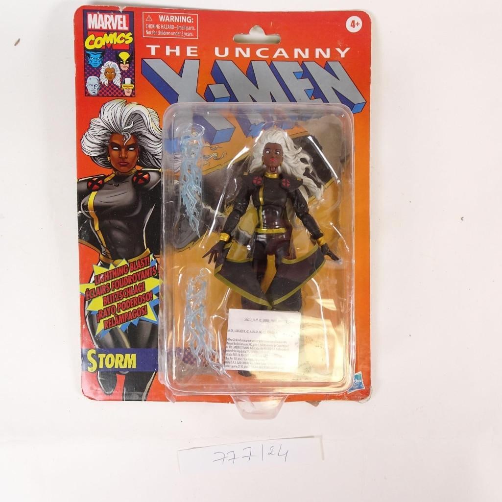 Marvel Comics The Uncanny X-Men: Marvel Comics The Uncanny X-Men Storm action figure.Figure is factory sealed on original card and includes lightning effect accessories.Packaging shows visible wear from storage, including edge wear,