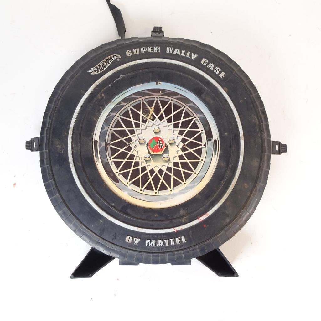 Vintage Hot Wheels Super Rally Case by Mattel: Original Hot Wheels Super Rally Case by Mattel, designed in the iconic tire / wheel shape, offered here with a mixed assortment of die-cast vehicles included. The case open
