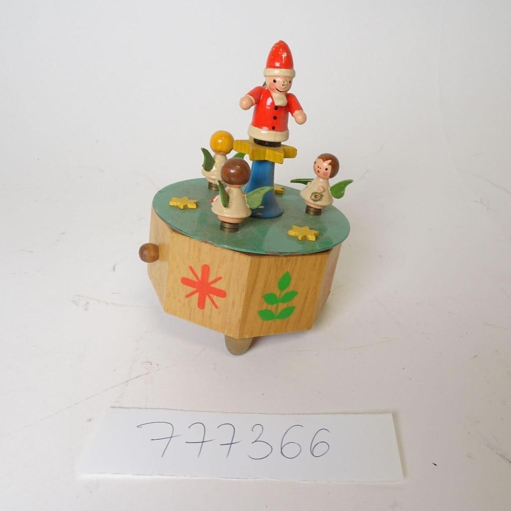 Vintage Wooden Christmas Music Box: Charming vintage wooden Christmas music box featuring Santa Claus standing on a central column, surrounded by four angel figures. The box is crafted from solid wood and hand-painted in warm holiday co