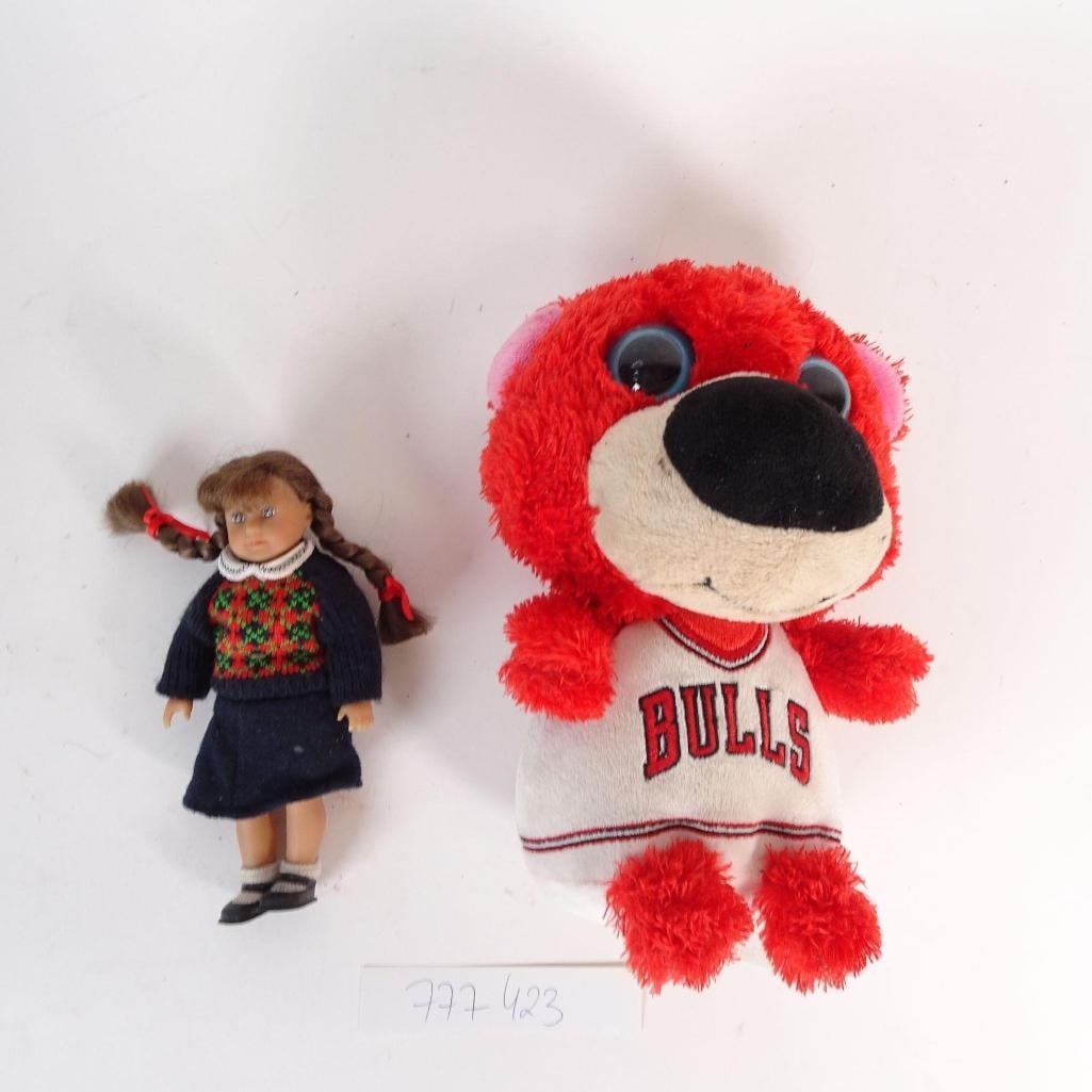 Toy Lot - Girl Doll & Bulls Plush Bear: Mixed two-toy lot sold as one auction lot. Lot includes: - girl doll with braided hair, wearing knit sweater and skirt - plush bear wearing a Chicago Bulls jersey