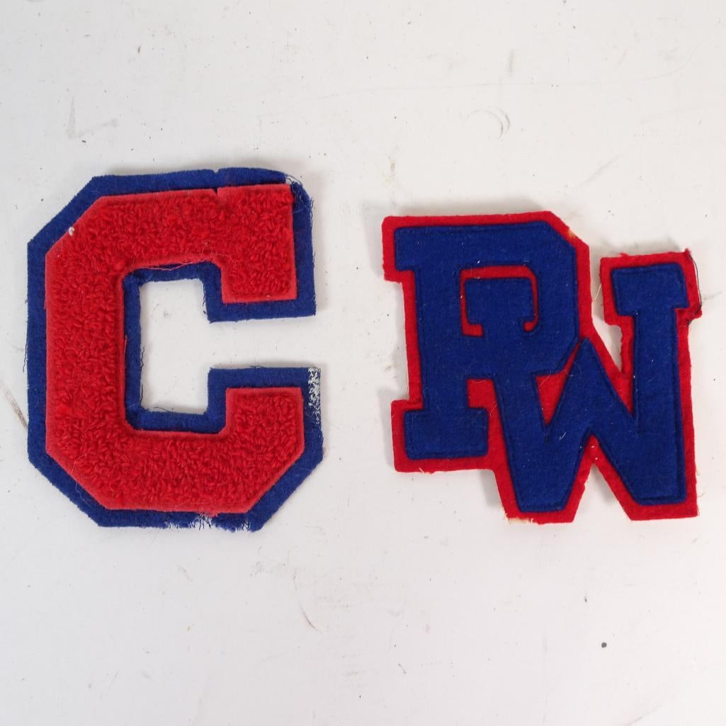 Vintage Chenille Varsity Letter Patches: Set of two vintage chenille varsity letter patches, featuring bold red and blue color combinations in classic athletic lettering styles. Includes one letter ?C? patch and one ?PW?