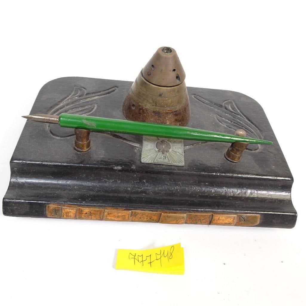 Polish Patriotic Memorabilia from World War I: The offered item is a historical patriotic memorabilia from World War I, consisting of a steel nib pen with green handle, a metal inkwell, and a heavy display base. Based on visible characteristics: -