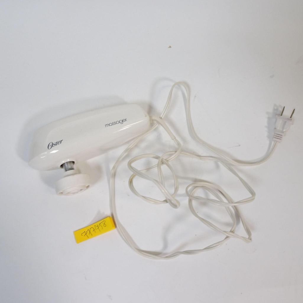 Oster Electric Handheld Massager: Vintage Oster electric handheld massager with original power cord. Classic corded design, ideal for muscle relaxation and everyday use.