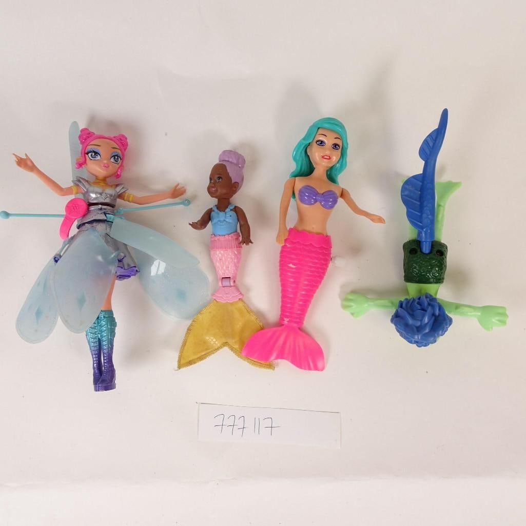 Toy Doll Lot: Mixed toy doll and figure lot sold as shown in photos.This lot includes:-Mermaid dolls (different sizes)-Fairy doll with wings-Fantasy / creature figures-Mixed accessoriesPlease review all photos care