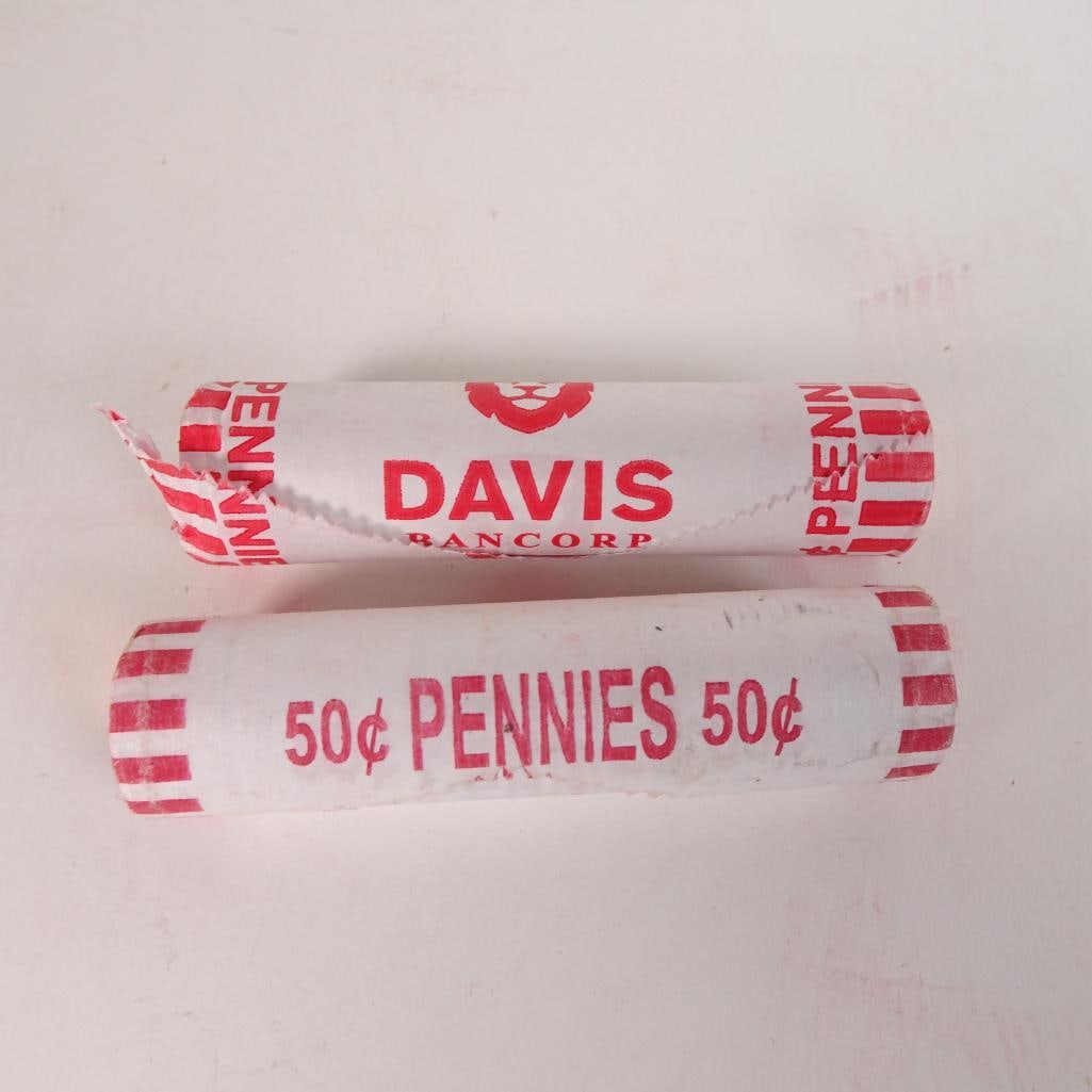 2 Bank Wrapped Penny Rolls: Lot of 2 bank-wrapped rolls of U.S. Lincoln pennies (50¢ each roll). Coins remain sealed in original paper wrappers as shown in photos. Great addition for coin collectors, beginners, or anyone who en