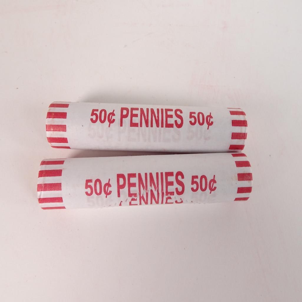 2 Bank Wrapped Penny Rolls: Lot of 2 bank-wrapped rolls of U.S. Lincoln pennies (50¢ each roll). Coins remain sealed in original paper wrappers as shown in photos. Great addition for coin collectors, beginners, or anyone who en