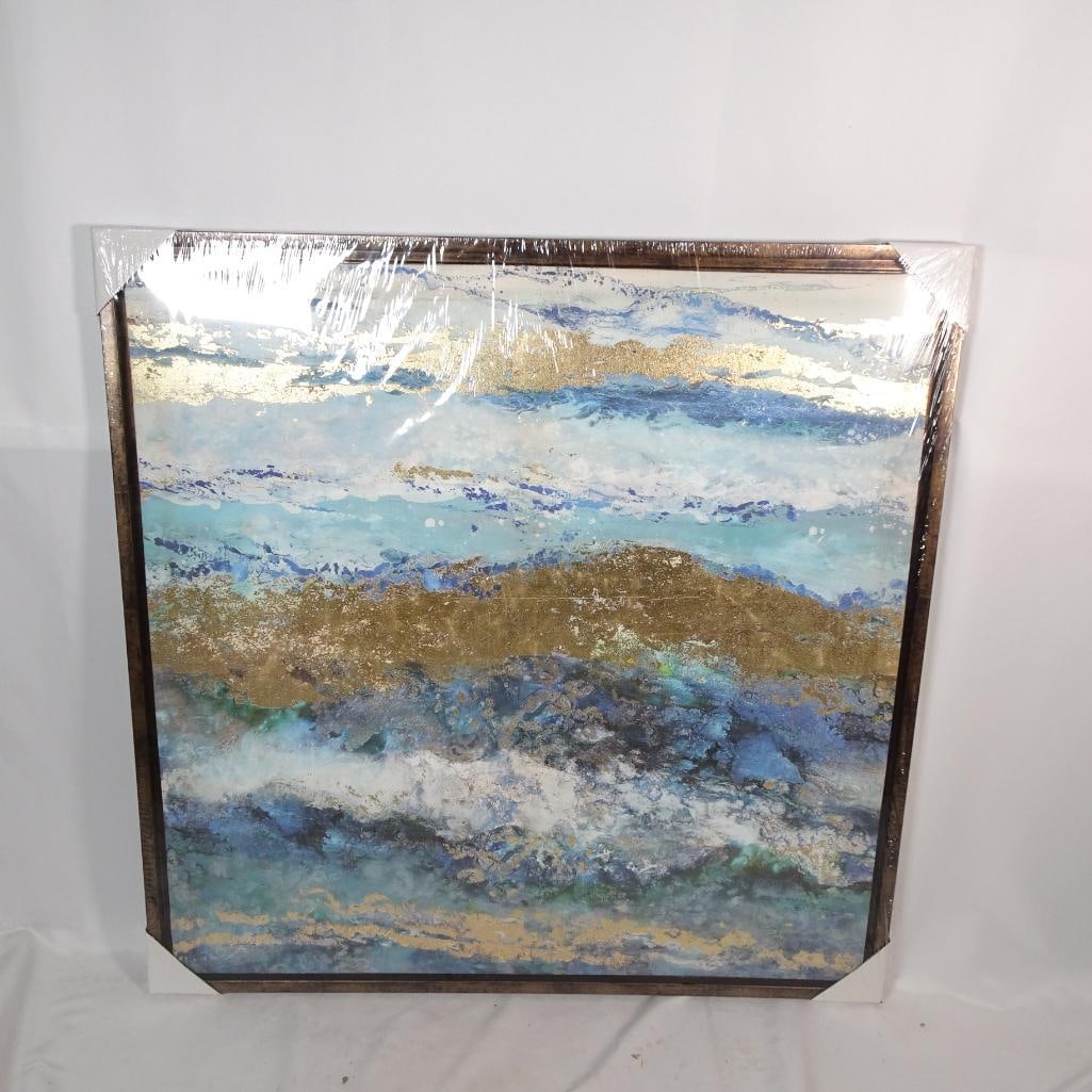 Large Coastal Abstract Canvas Wall Art: Large contemporary coastal abstract canvas featuring layered ocean-inspired brushwork in shades of blue, aqua, white, and textured metallic gold accents. Beautiful dimensional texture with gold leaf