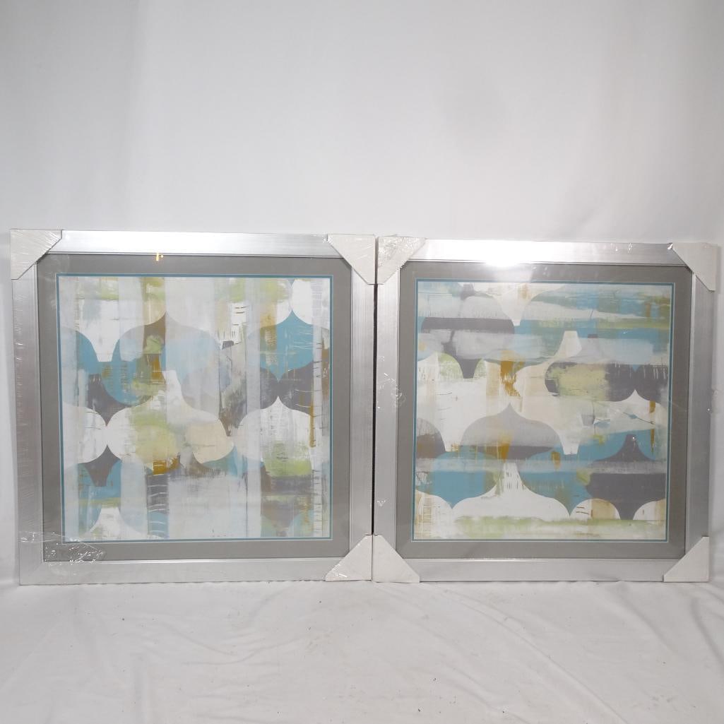 Set of 2 Large Framed Abstract Wall Art: Set of two large framed abstract artworks featuring layered geometric shapes in soft blue, green, gray, and white tones. The modern square format and coordinated design create a balanced, designer-sty