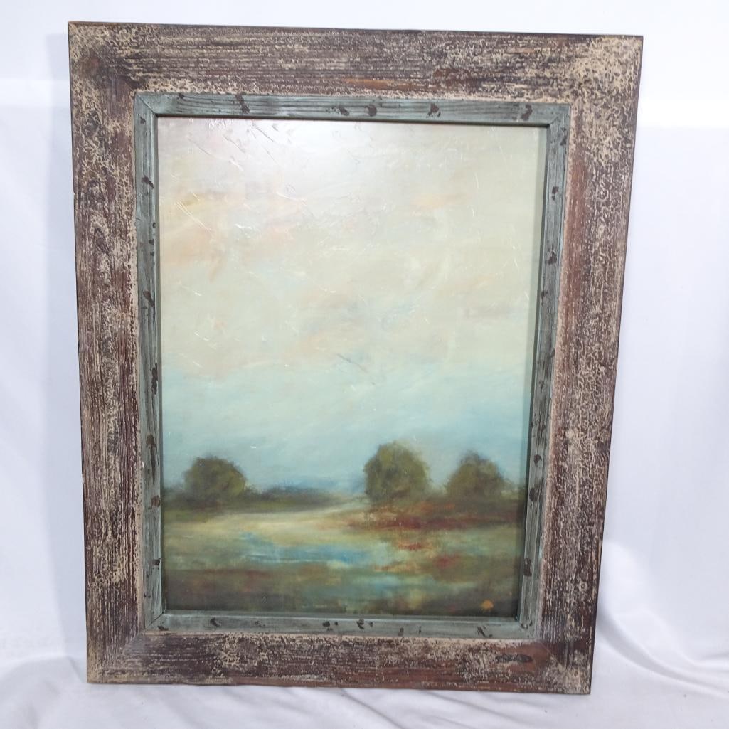 Large Framed Rustic Landscape Wall Art: Beautiful large framed landscape wall art featuring soft muted tones of blue, green, cream, and subtle red accents. The artwork has a textured finish and is set in a heavily distressed rustic wood fra