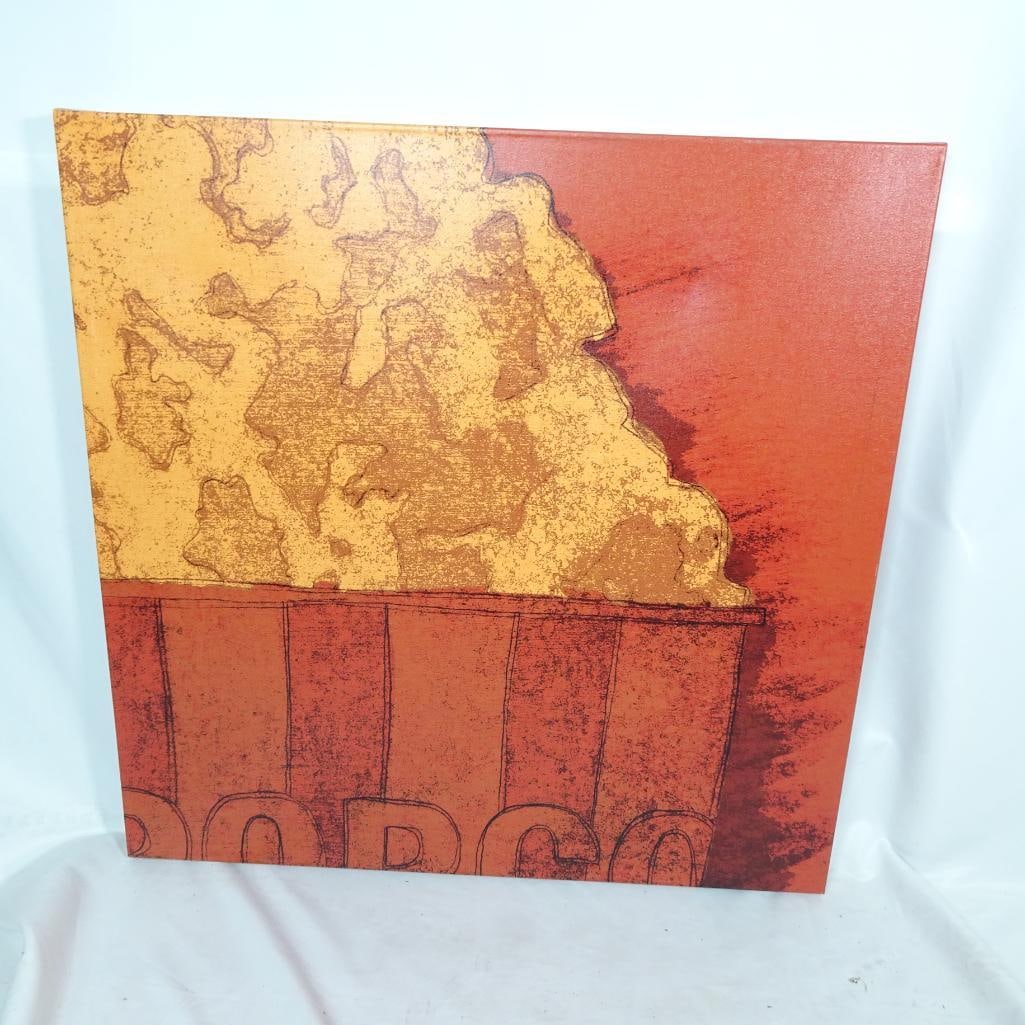 Large Popcorn Canvas Wall Art: Bold and modern popcorn-themed wall art printed on stretched canvas. This large 30? x 30? square canvas features warm red and golden tones with a graphic popcorn design ? perfect for entertainment