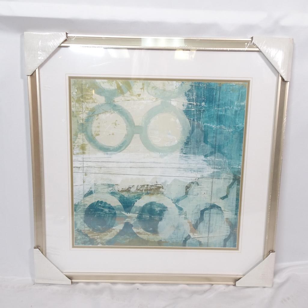 Large Framed Abstract Wall Art: Large framed abstract artwork featuring soft geometric forms in teal, beige, and neutral tones. The layered textures and modern color palette create a fresh, contemporary focal point perfect for