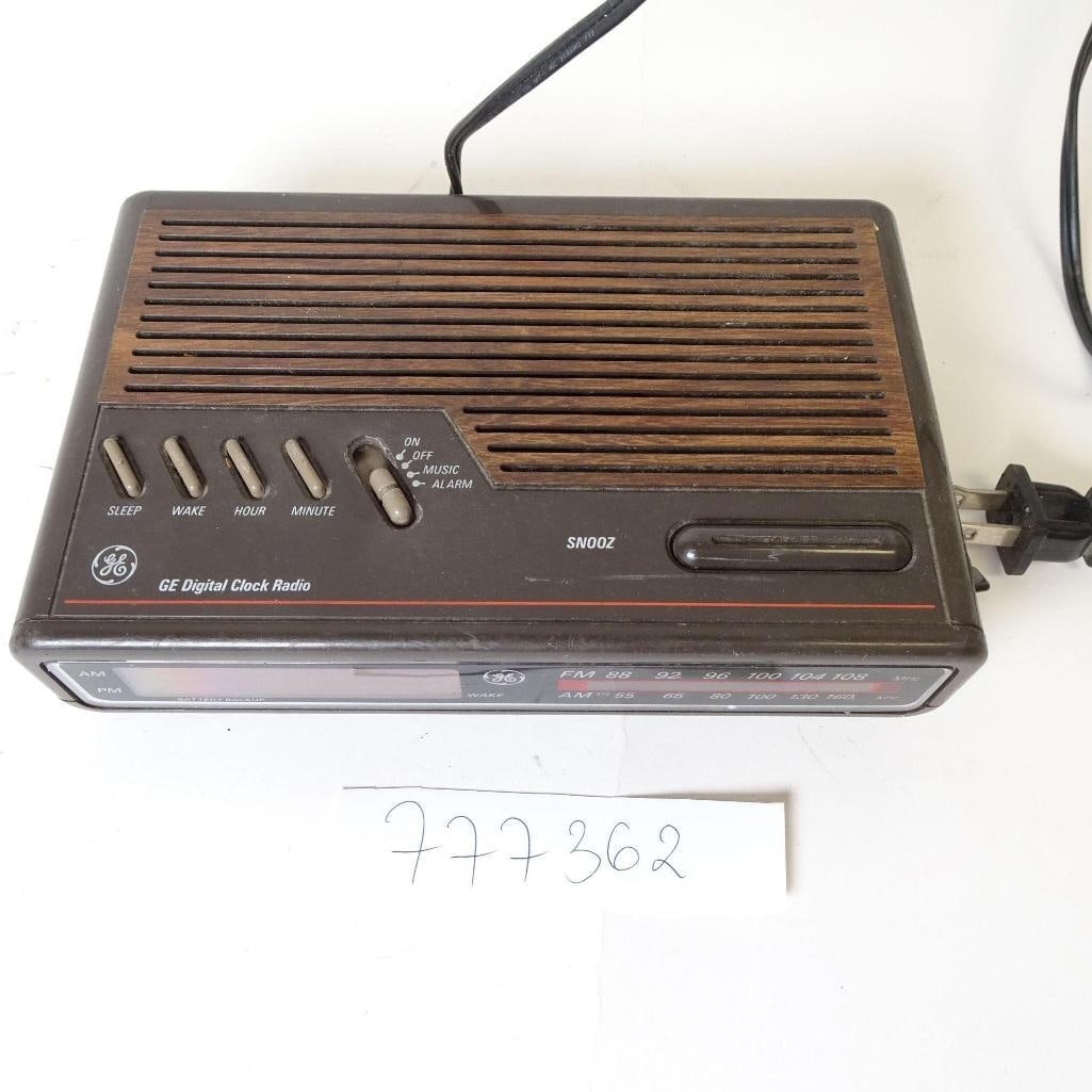 Vintage GE Digital Clock Radio AM/FM: Vintage General Electric digital alarm clock radio with classic woodgrain-style finish. Features AM/FM radio, digital clock display, snooze function, alarm with music or buzzer, and battery backup. A