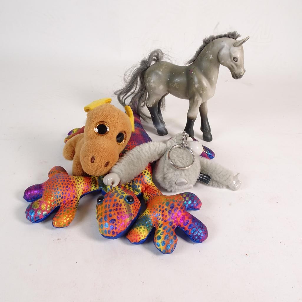 Bright & Fun Toy Mix: A vibrant and eclectic 4_piece toy bundle featuring a mix of plush animals and a vintage-style horse figurine. A fun assortment for kids, crafters, collectors, or resellers looking for a unique