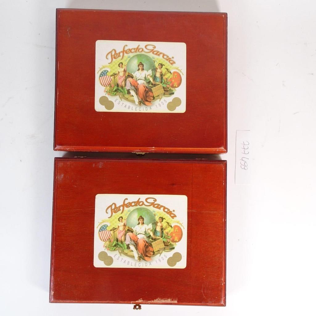 Lot of 2 Perfeito Garcia Sampler Cigar Boxes: Lot of two vintage Perfeito Garcia Sampler wooden cigar boxes. Each box features the original red exterior label with classic Perfeito Garcia artwork and interior printed branding. Hinged wooden const