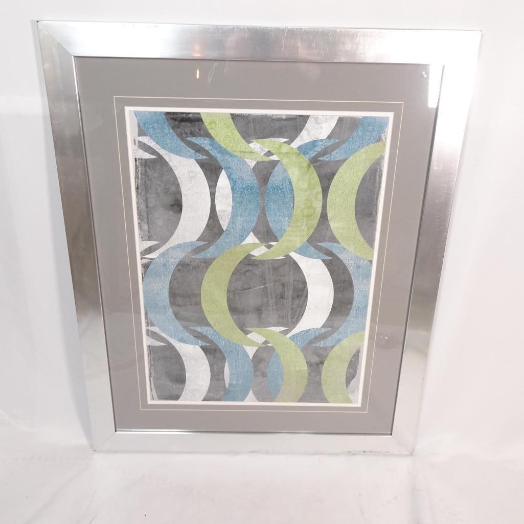 Large Framed Modern Geometric Abstract Wall Art: Large modern abstract geometric wall art featuring an overlapping circular pattern in blue, green, white, and gray tones. The contemporary design creates a layered visual effect that works beautifully