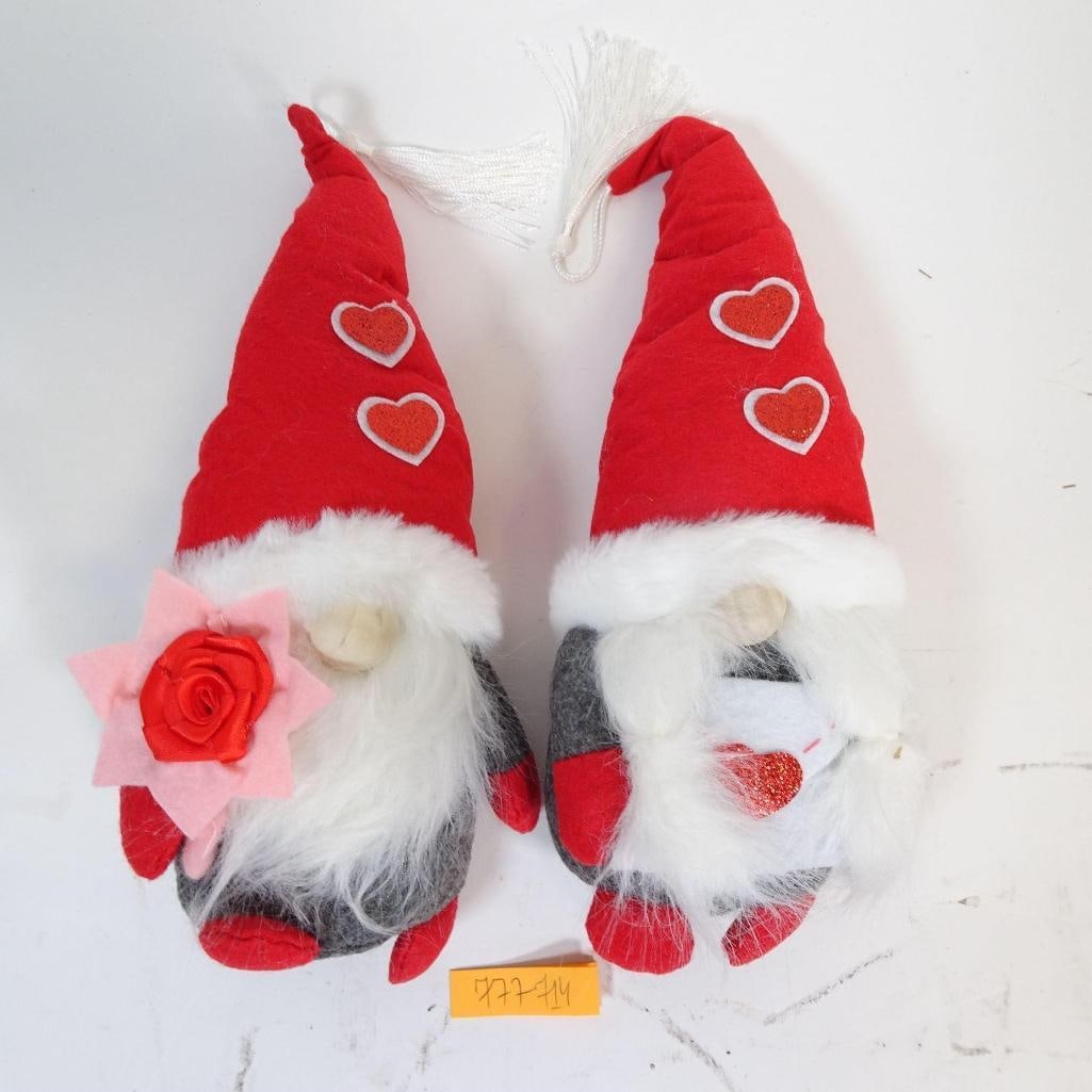Set of 2 Christmas Gnomes: Charming set of two decorative gnomes in red and gray tones with romantic heart details. The gnomes feature tall red hats decorated with hearts, fluffy white beards, and soft textile finishes. One gno